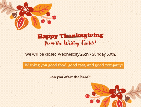 A presenter standing in front of a whiteboard wall with writing on it, surrounded by 4 students.